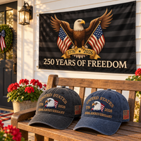 250th Anniversary Eagle Cap gift set lifestyle: Charcoal & Navy hats with 3x5 Black Eagle 250 Years of Freedom Flag