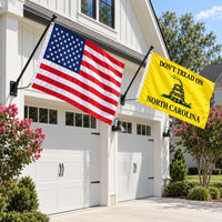 Heavy Duty American Flag and Don't Tread on North Carolina Flag 3x5 2-Pack displayed outdoors