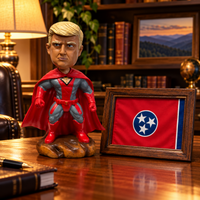 Superhero Patriot bobblehead on an office desk next to a framed Tennessee flag (lifestyle)