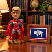 Superhero Patriot bobblehead on an office desk next to a framed Wyoming flag (lifestyle)