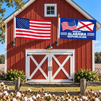 American flag and Proud Alabama Republican flag flying side by side outdoors