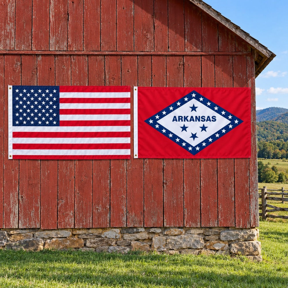 American flag and Arkansas State Flag flying side by side outdoors