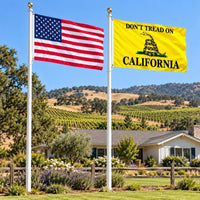 American flag and Don't Tread on California flag flying side by side outdoors