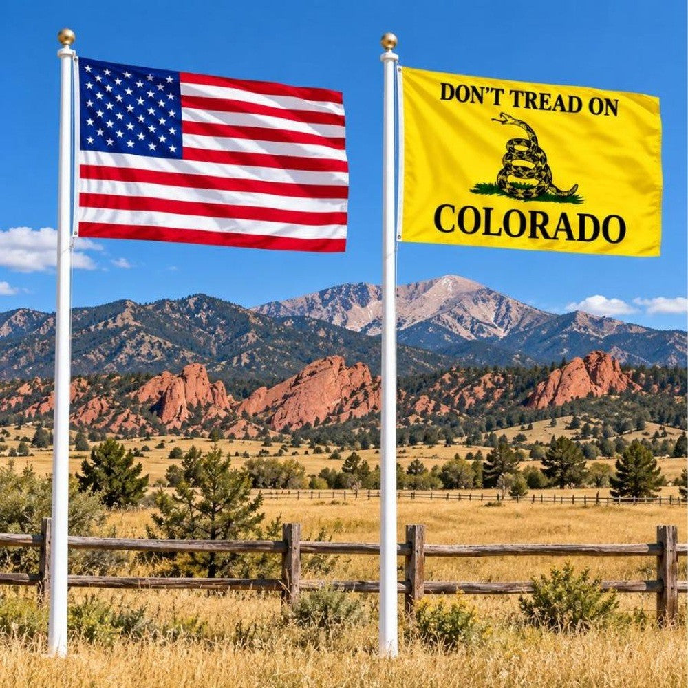 American flag and Don't Tread on Colorado flag flying side by side outdoors