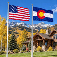 American flag and Colorado State Flag flying side by side outdoors