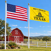 American flag and Don't Tread on Texas flag flying side by side outdoors