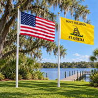 American flag and Don't Tread on Florida flag flying side by side outdoors