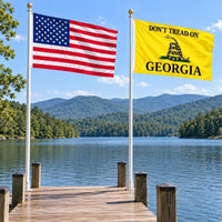 American flag and Don't Tread on Georgia flag flying side by side outdoors