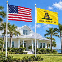 American flag and Don't Tread on Me (Gadsden) flag flying side by side outdoors