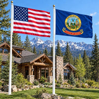 American flag and Idaho State Flag flying side by side outdoors
