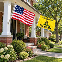 American flag and Don't Tread on Illinois flag flying side by side outdoors