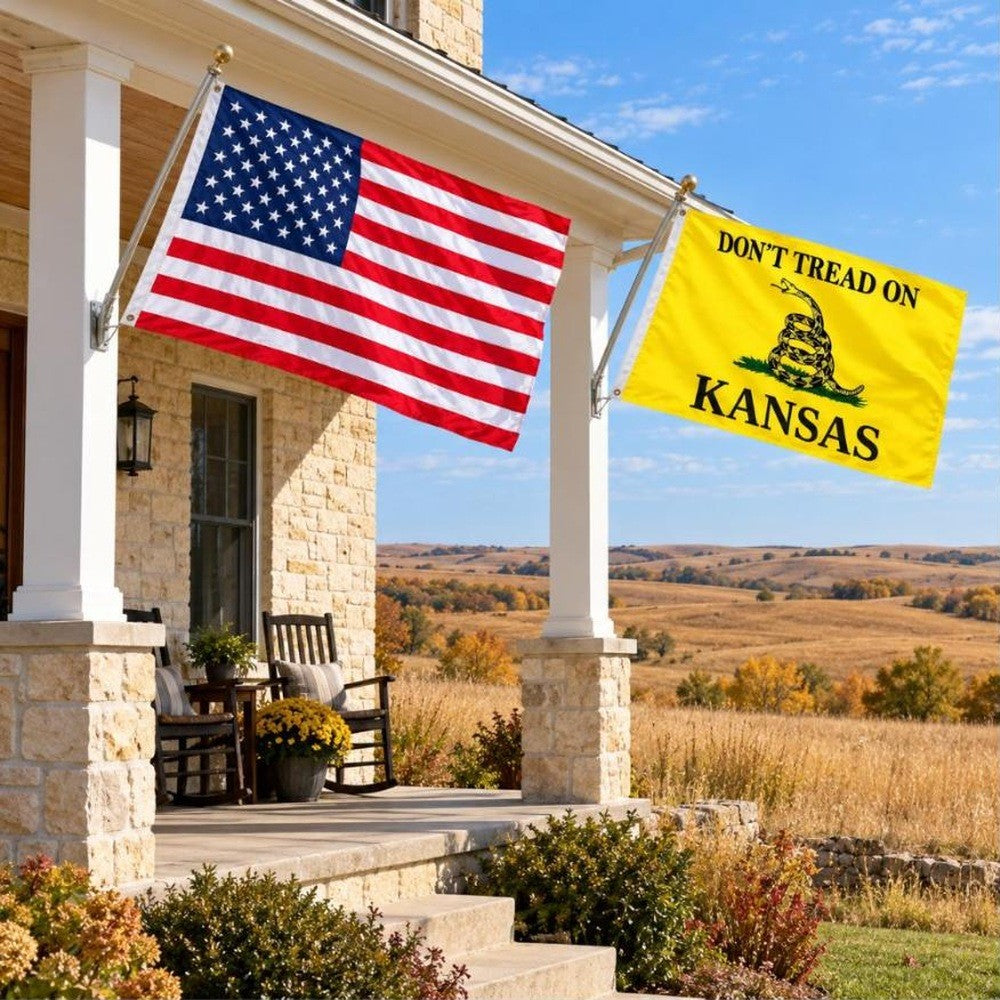 American flag and Don't Tread on Kansas flag flying side by side outdoors