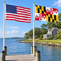 American flag and Maryland State Flag flying side by side outdoors