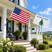 American flag and Appeal to Heaven flag flying side by side outdoors