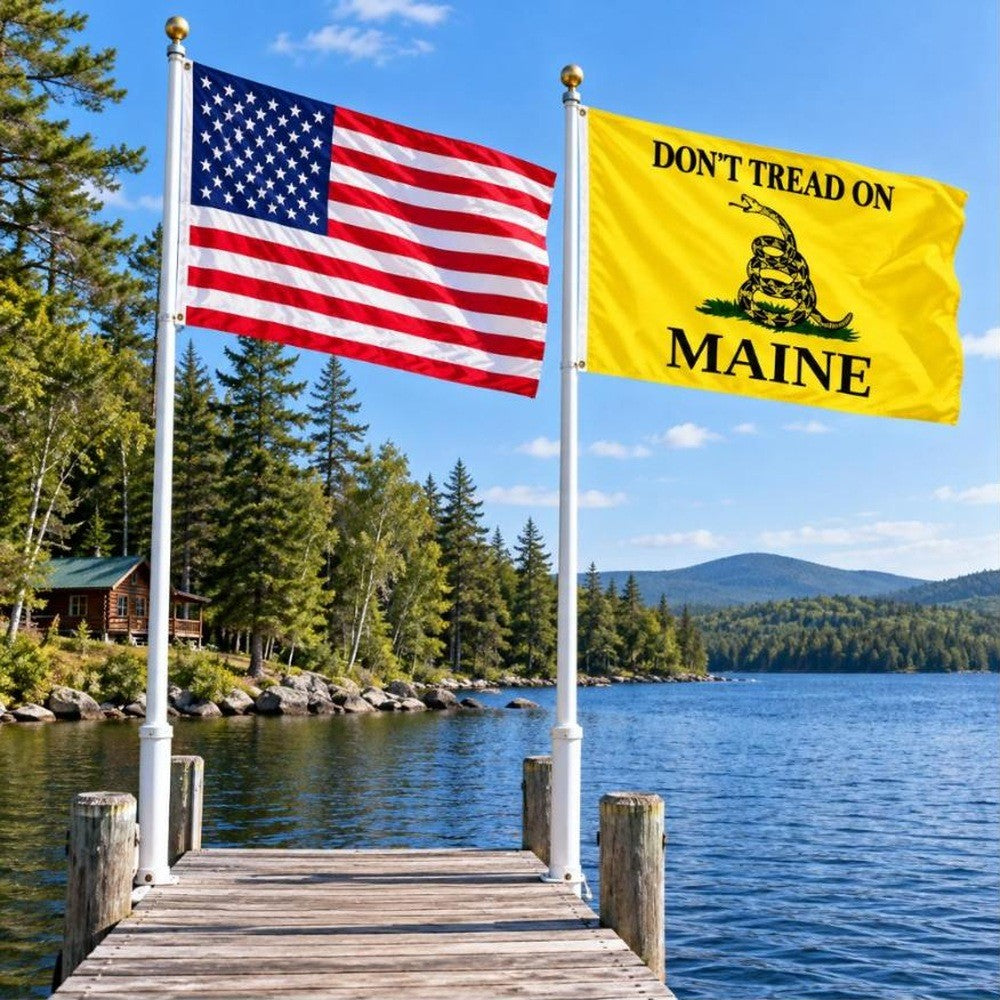 American flag and Don't Tread on Maine flag flying side by side outdoors