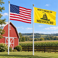 American flag and Don't Tread on Missouri flag flying side by side outdoors