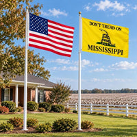 American flag and Don't Tread on Mississippi flag flying side by side outdoors