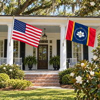 American flag and Mississippi State Flag flying side by side outdoors