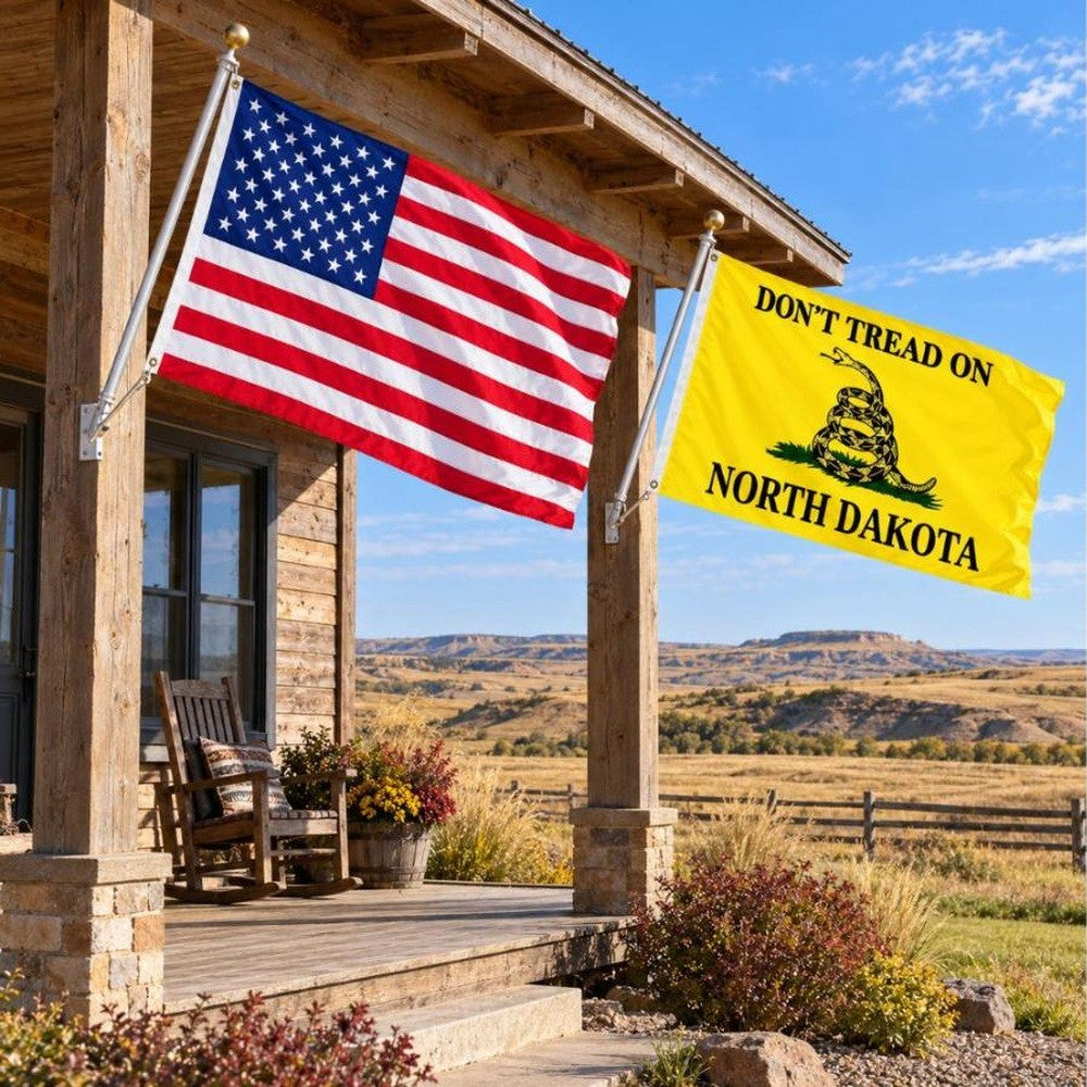 American flag and Don't Tread on North Dakota flag flying side by side outdoors