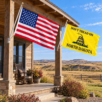 American flag and Don't Tread on North Dakota flag flying side by side outdoors