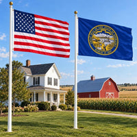 American flag and Nebraska State Flag flying side by side outdoors