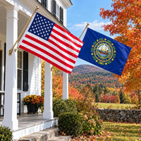 American flag and New Hampshire State Flag flying side by side outdoors
