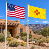 American flag and New Mexico State Flag flying side by side outdoors