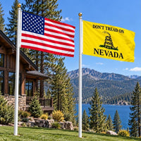 American flag and Don't Tread on Nevada flag flying side by side outdoors