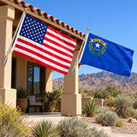 American flag and Nevada State Flag flying side by side outdoors