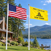 American flag and Don't Tread on New York flag flying side by side outdoors