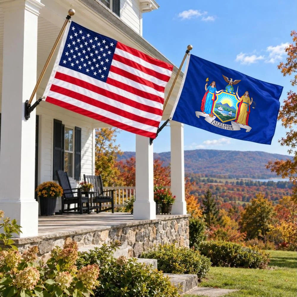 American flag and New York State Flag flying side by side outdoors