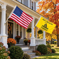 American flag and Don't Tread on Ohio flag flying side by side outdoors
