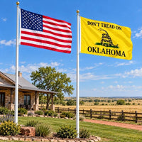 American flag and Don't Tread on Oklahoma flag flying side by side outdoors