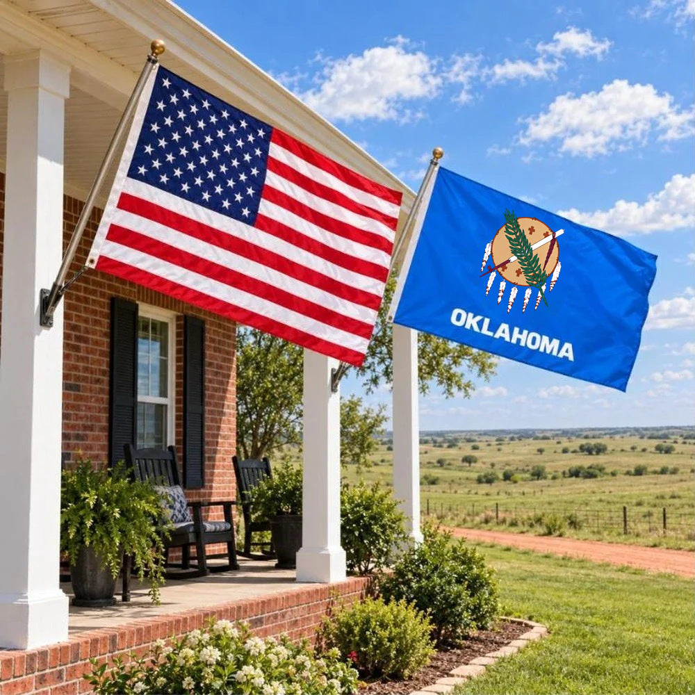 American flag and Oklahoma State Flag flying side by side outdoors