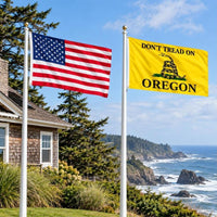 American flag and Don't Tread on Oregon flag flying side by side outdoors