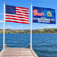 American flag and Proud South Dakota Republican flag flying side by side outdoors