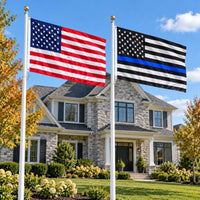 American flag and Thin Blue Line flag flying side by side outdoors