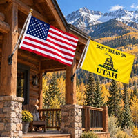 American flag and Don't Tread on Utah flag flying side by side outdoors