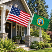 American flag and Washington State Flag flying side by side outdoors