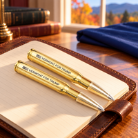 Vermont bullet pen 2 pack on a leather notebook (lifestyle)