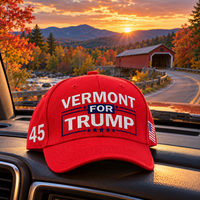 Vermont embroidered red hat on a truck dashboard at sunset (lifestyle)