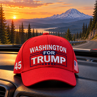 Washington embroidered red hat on a truck dashboard at sunset (lifestyle)