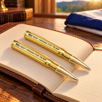 West Virginia bullet pen 2 pack on a leather notebook (lifestyle)