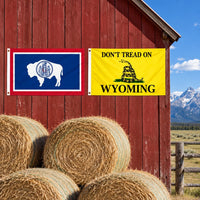 Wyoming State Flag and Don't Tread on Wyoming Flag 3x5 2-Pack displayed outdoors